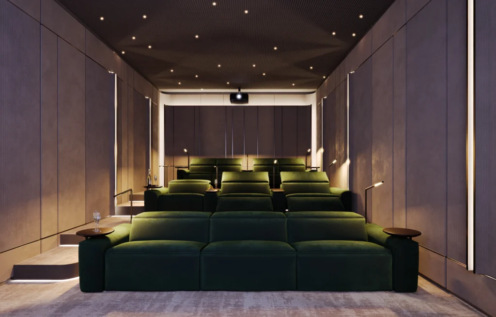 A luxurious cinema room with plush green seating, soft lighting, and a projector, offering a perfect cinematic experience in a comfortable setting. Luxury homes for families